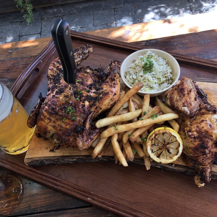 Half roasted chicken with fries and slaw at Bratz Y'all