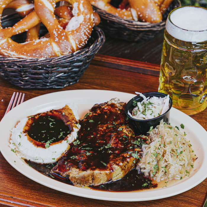 Roasted pork chop with spaetzle and sauerkraut at Bratz Y'all